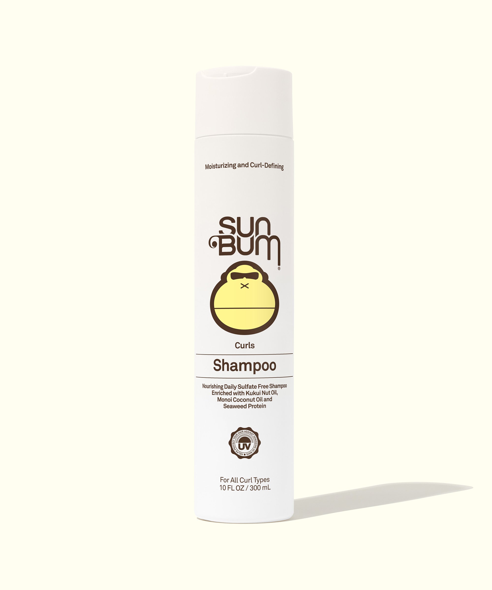 Curly Hair Shampoo - Front view of a white bottle of Curls Shampoo highlighting its ingredients and benefits for curly hair on a light background. The label features detailed product information. Sun Bum