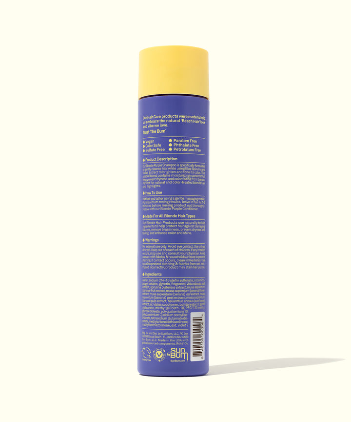 Back view of a bottle of Blonde Purple Shampoo with a yellow cap, featuring key ingredients like Blue Spirulina, Violet extracts, and Banana, designed to cleanse and tone natural and color-treated blonde and brown hair. Sun Bum.
